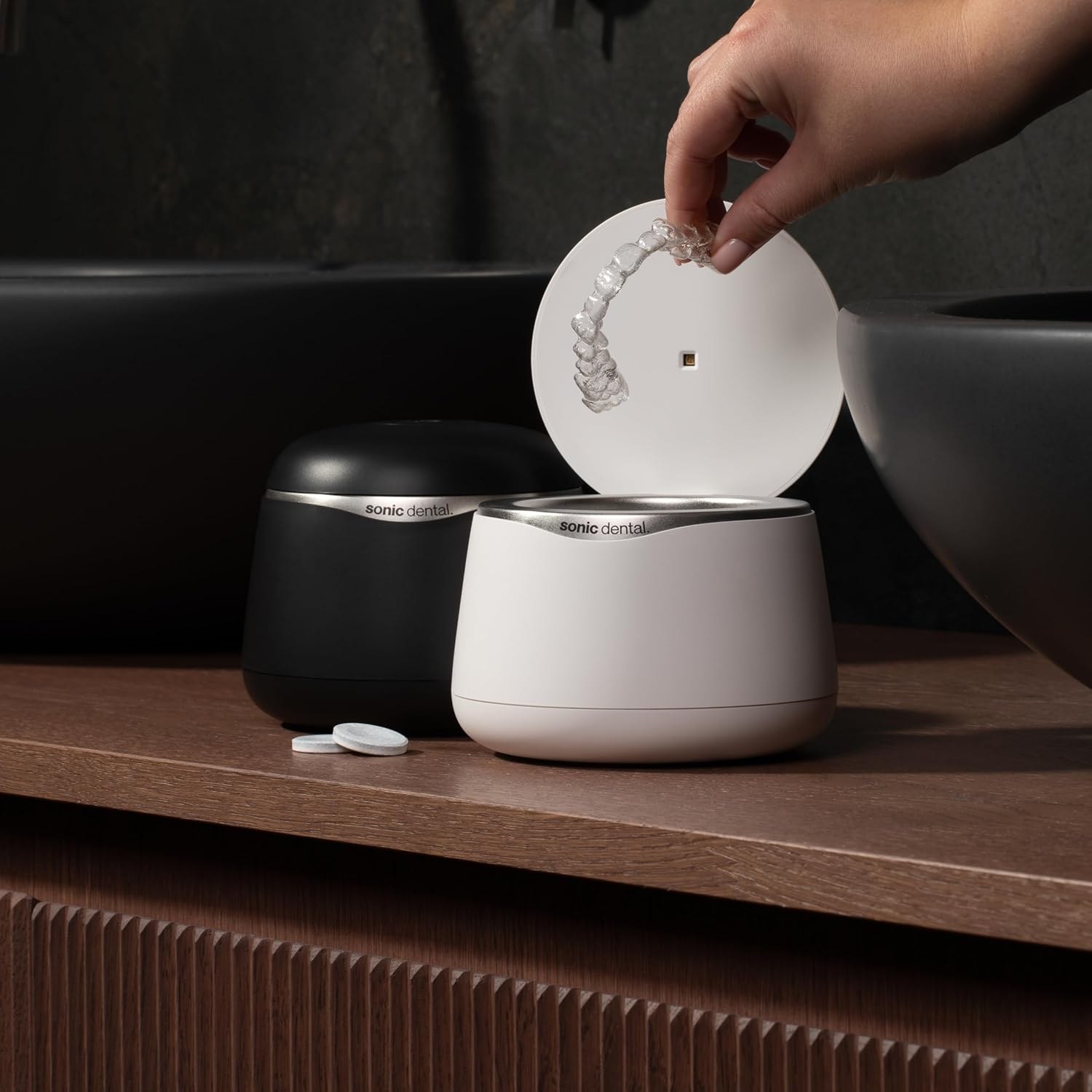 Sonic Pro Dental Cleaning Pod, a compact clinical-grade ultrasonic cleaner